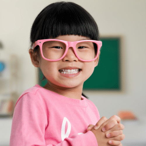 Young child smiling during early orthodontic evaluation at Boyd Orthodontics in Glen Allen, VA 23059